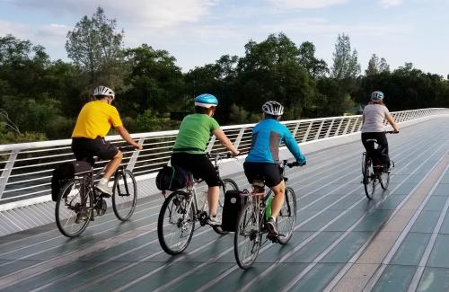 Cyclists riding over the Sundial Bridge