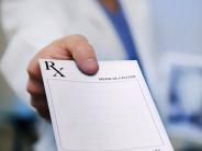 doctor holding prescription form