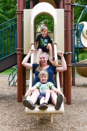 Amber and boys on playground slide