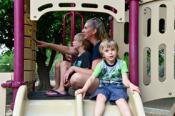 Amber teaching boys on playground