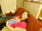 Amy on couch with baby