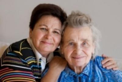 Elderly woman with daughter stock photo