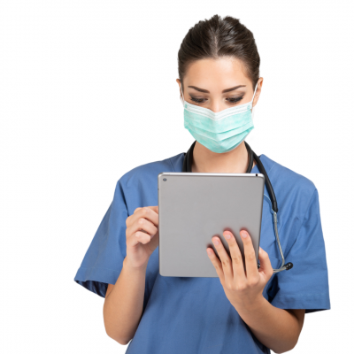 Doctor wearing a mask reading a tablet