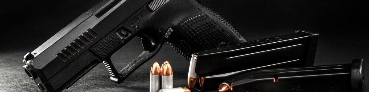 Photo of handgun and ammo on table