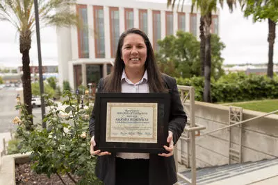 Amanda Portrait holding plaque