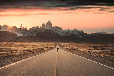 photo of man along on road
