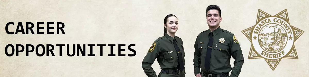 Photo of two jail staff and sheriff star